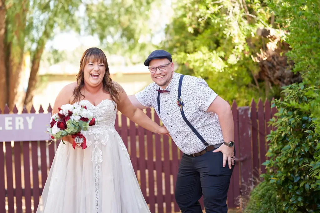Bride and groom sharing a candid funny moment and laughter