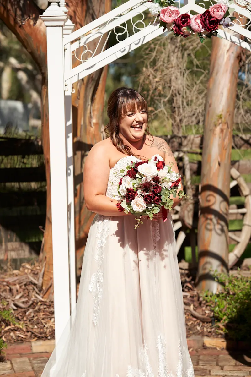 bendigo pottery wedding ceremony bride standing holding a bouquet bendigo pottery wedding ceremony bride standing holding a bouquet