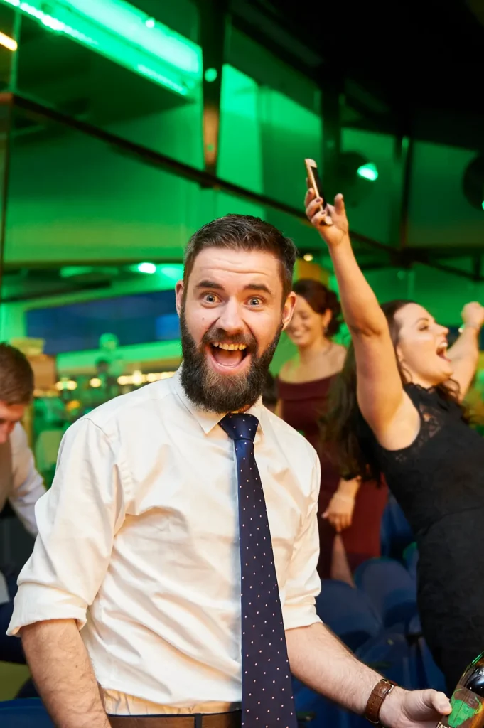 Guests celebrating with excitement during a Melbourne awards night and gala dinner, capturing a joyful and energetic moment.