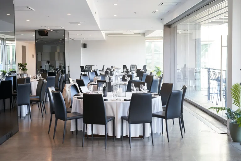 garryowen awards night venue setup wide room melbourne Wide shot of the venue setup for the Garryowen Awards Night, showing tables and floor-to-ceiling glass windows filling the room with natural light